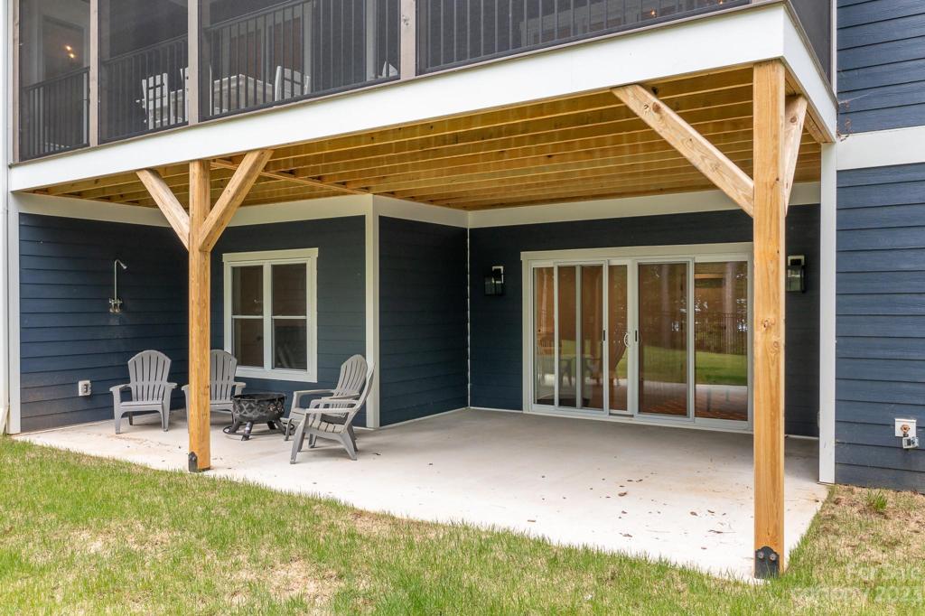 Covered patio with sliding doors from basement