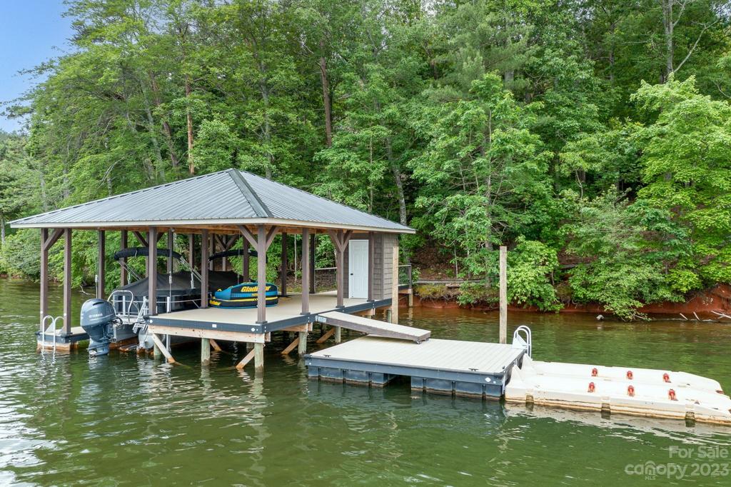 Covered dock with floating swim area