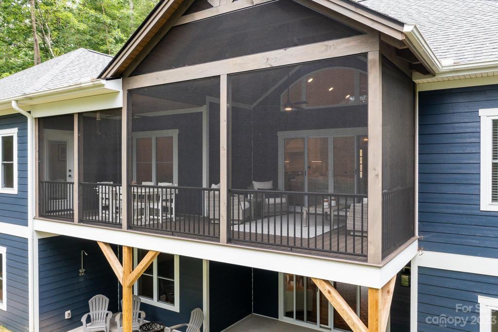 Screened porch with vaulted ceilings.