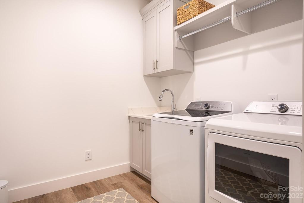 Laundry room with sink and built in cabinet