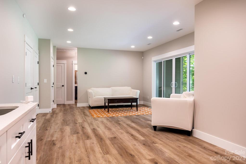 Basement living room with built in cabinets