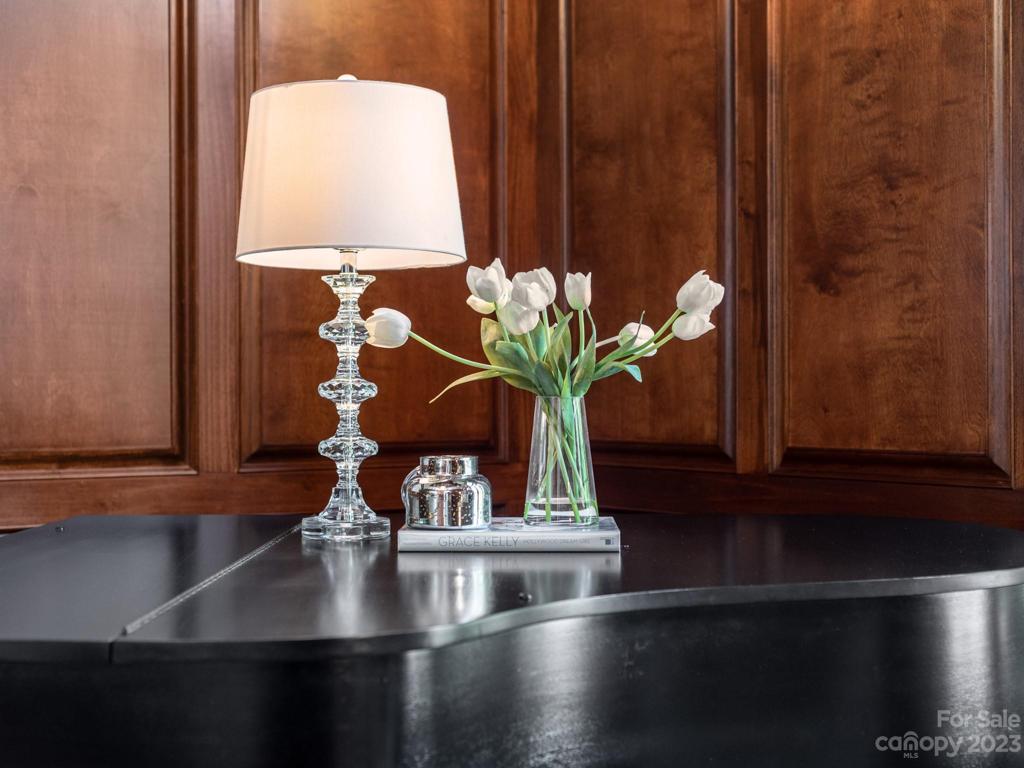 Featuring rich paneled walls and deep coffered ceiling detail.