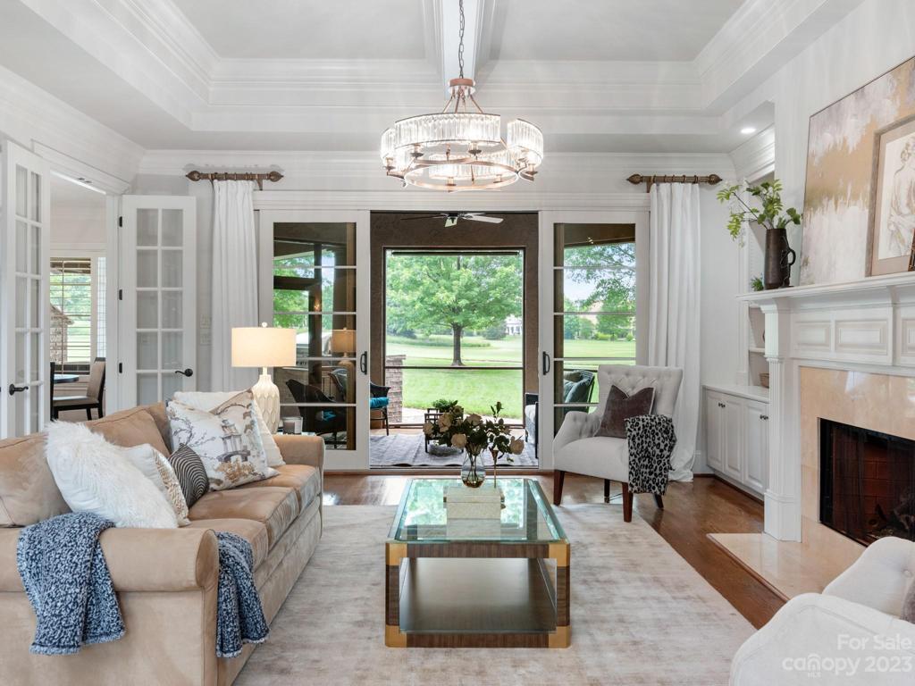 Main Floor living room opens to screened porch for more entertainment space!