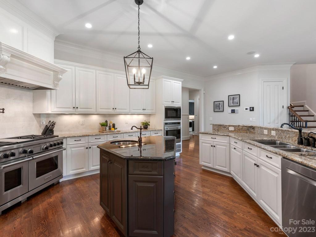 Wolf 6-burner gas cooktop, 3 ovens and warming drawer.  Sub-Zero refrigerator & Bosch dishwasher.