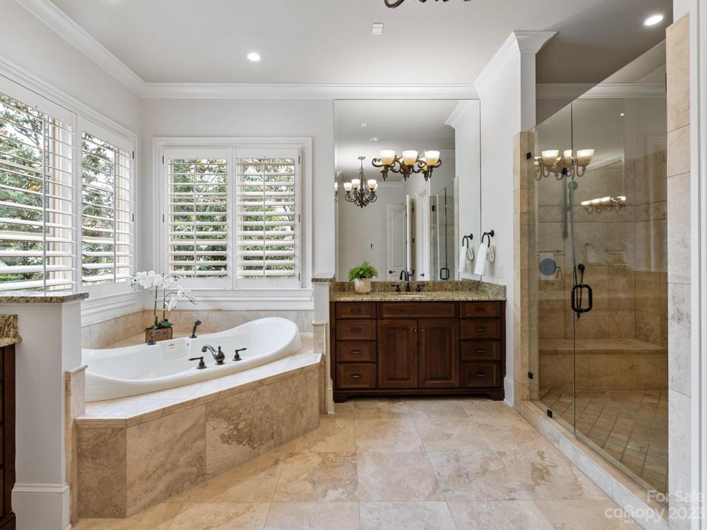 Owner's suite features 2 lavoratories, large wal-in shower, separate vanities and jacuzzi tub.