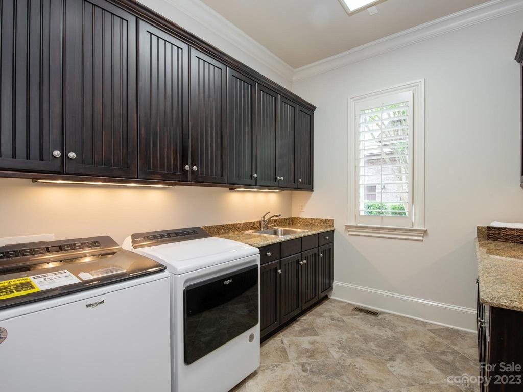 1st & 2nd floor laundry rooms both have sink and storage!