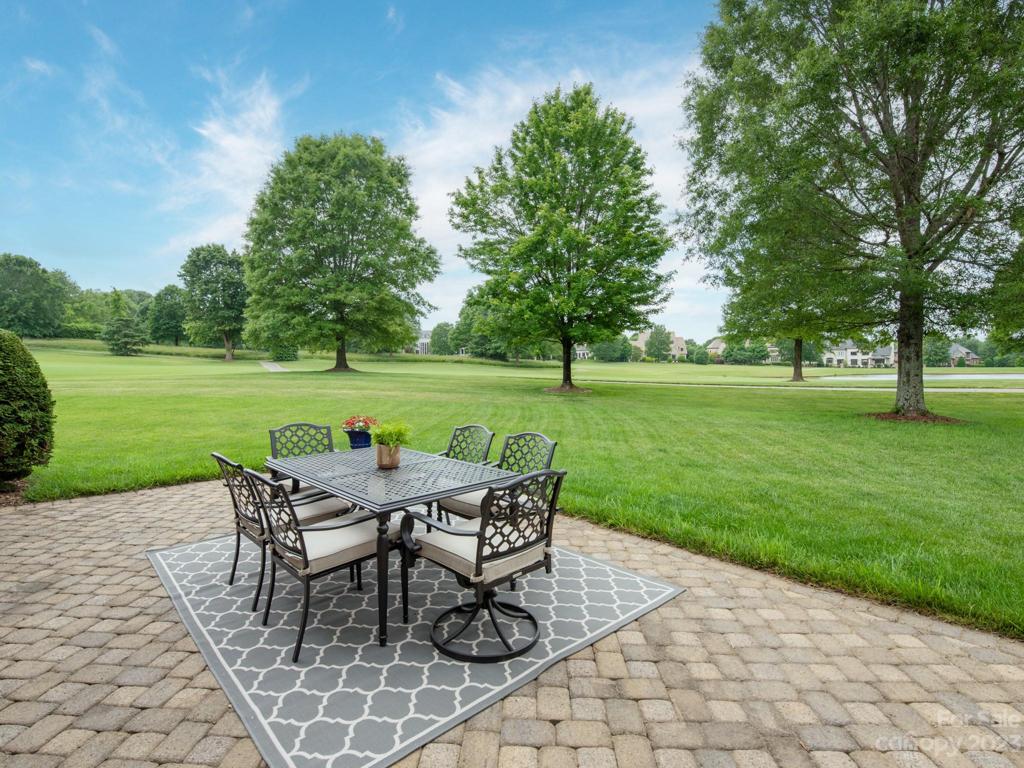 Al fresco dining with breathtaking views across 2 fairways and pond w/fountain.