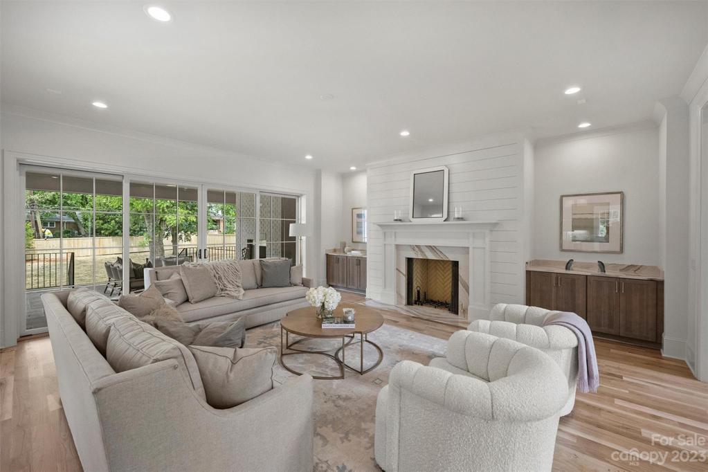 Sliding glass doors seamlessly connect the living area to the expansive 310 square foot covered patio.
