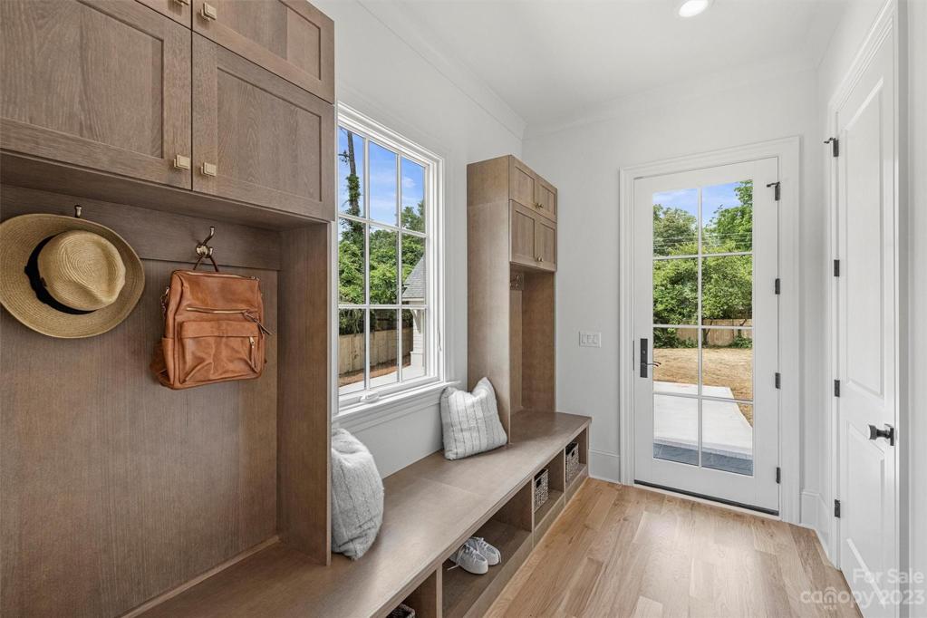 Droo-zone with custom locker-style cabinetry for neat and easy storage.
