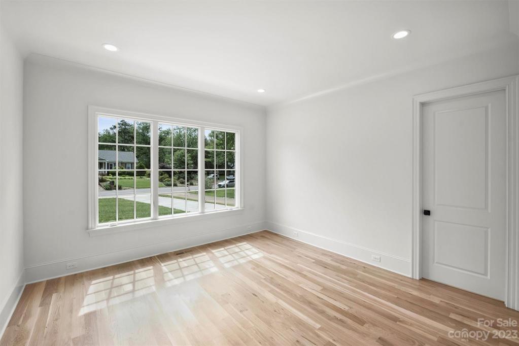 Main level guest suite (or office) with a second full bath on the main level offers additional convenience and versatility.