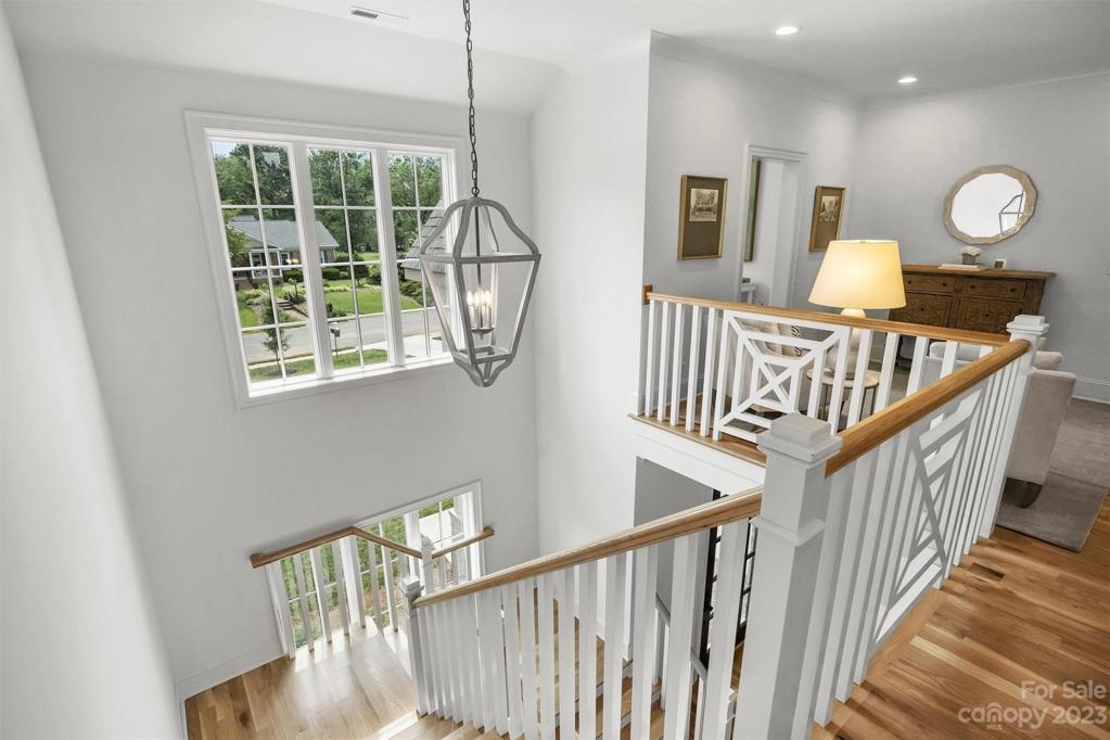 Upstairs, discover four additional bedrooms, each accompanied by their own ensuite bathroom and walk-in closet, ensuring privacy and comfort for all.