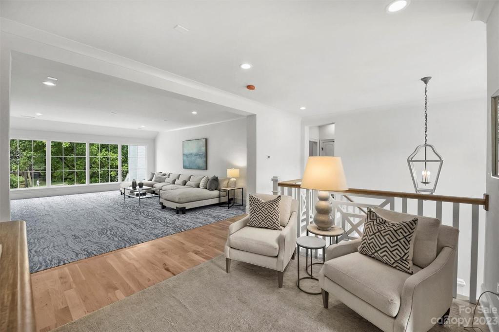 The upper-level landing presents a generously sized bonus room as well as a versatile flex space, ideal for a second office or dedicated homework room.