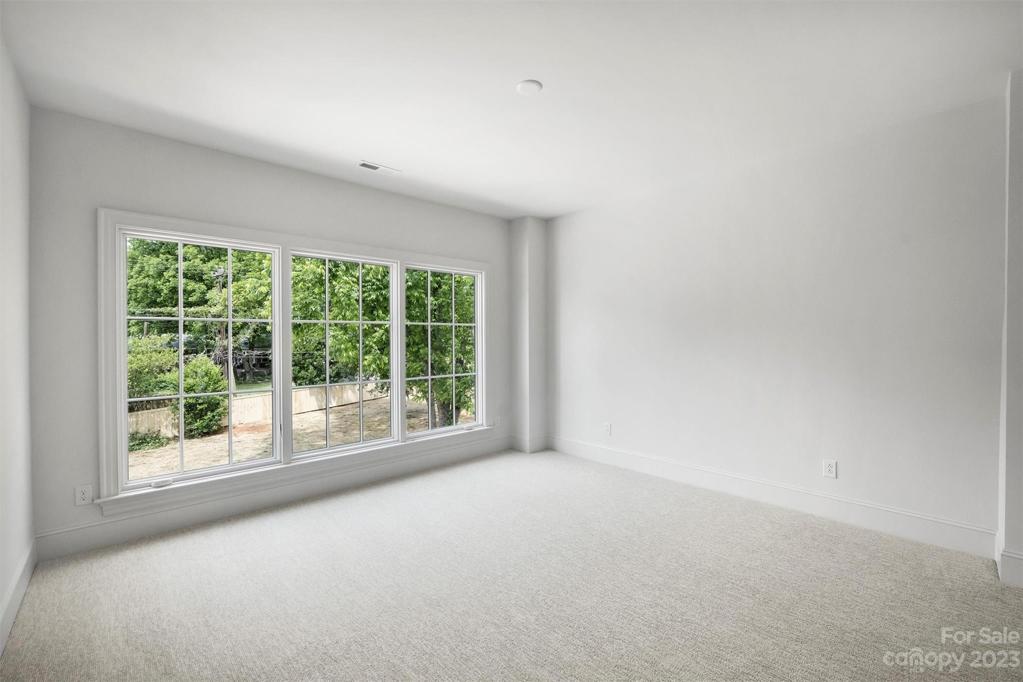 Bedroom 3 with its own walk-in closet and ensuite bathroom.