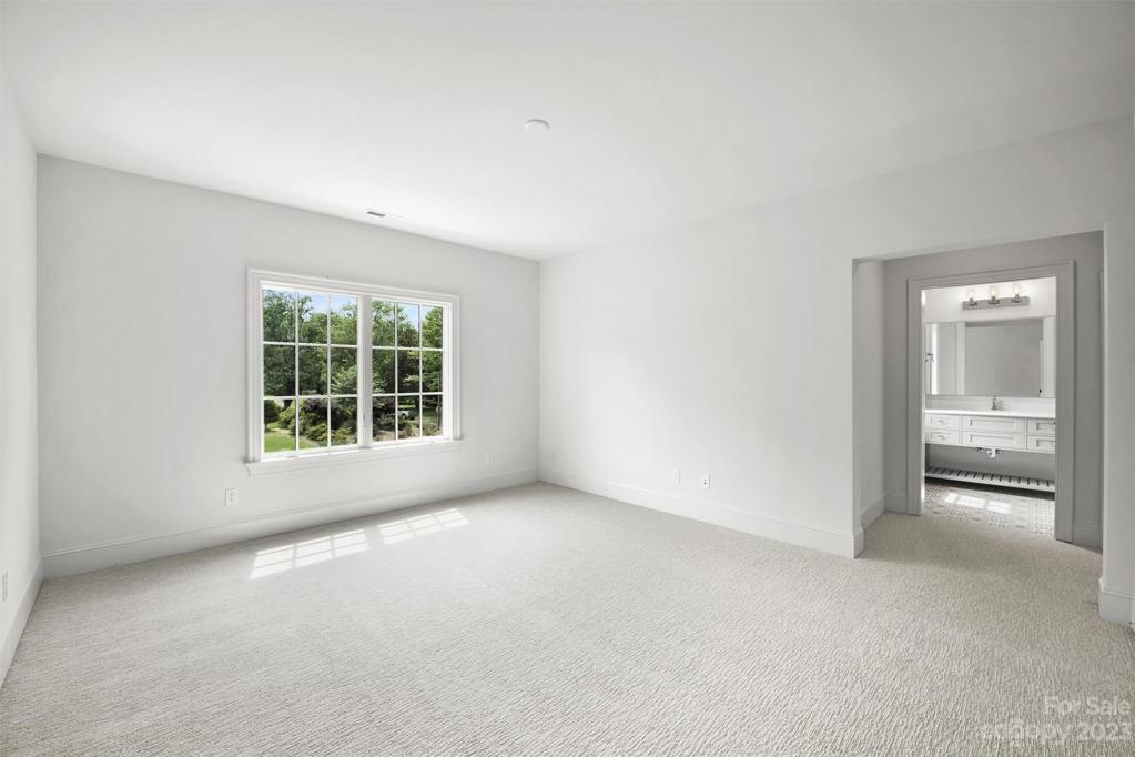 Bedroom 4 with its own walk-in closet and ensuite bathroom.