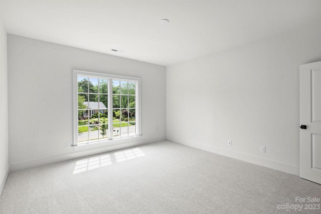 Bedroom 6 with its own walk-in closet and ensuite bathroom.