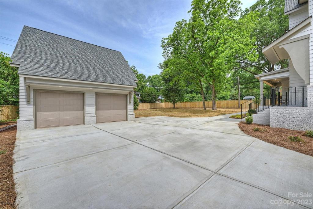 This exceptional residence is complimented by a detached 2-car garage and fenced backyard.