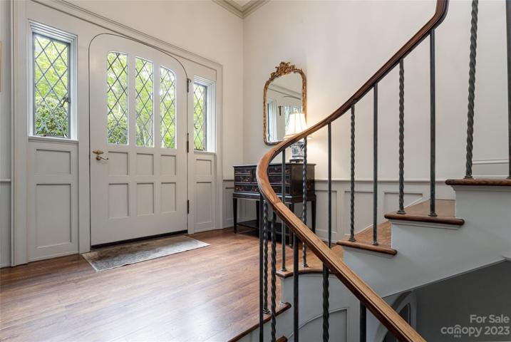 Upon entering from the detached garage in back, this reception landing welcomes you home