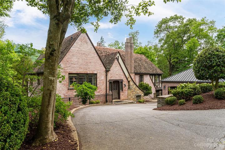 This time, when we go back inside, let's enter via the back door. Note the 2-car garage on the right - which also has a copper standing seam roof.