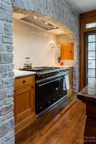 Imagine creating your sumptuous feast in this inviting focal point surrounded by family and friends!