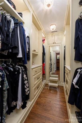 The second of two spacious custom handmade walk-in closets in the Primary En-Suite
