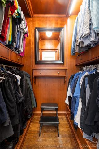 One of two spacious handmade custom walk-in closets in the Primary En-Suite