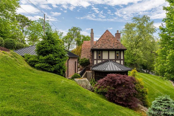 Once outside, lush & verdant landscaping await you thanks to the landscape designer/architect & sculptor Kirk Alexander. Note the copper standing seam roof on top of your sunroom. That copper matches the original copper gutters, scupper boxes, and downspouts which were all restored.
