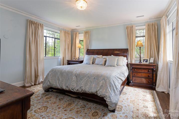 Your Primary Bedroom encircles you with peaceful views of nature through 4 new windows that were made by the same manufacturer of the home's original windows.