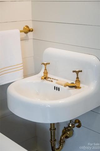...a quaint sink in the attic from Lefroy & Brooks with original hardware from when the home was initially built with a sink right here in 1928! All of the plumbing and electrical i this home have been renovated and restored.