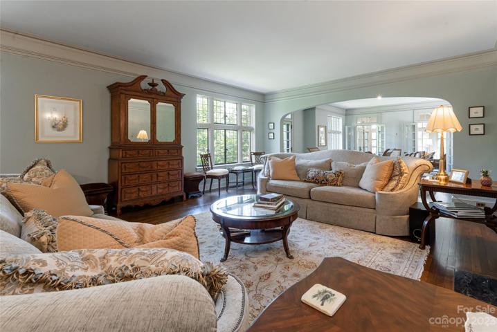 Historic details from the crown molding to the picture rail molding to the substantial baseboards to the arched doorways to the ageless hardwood floors are brought to life here