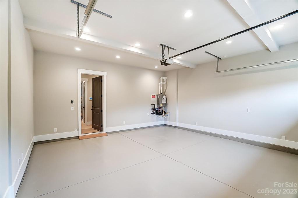 Garage with coated flooring & tankless waterheater