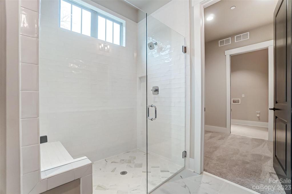 Primary Bath with tiled shower & seat