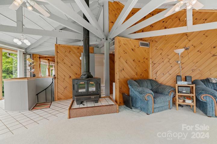Wood burning stove is perfect for the cooler evenings in this open concept upper/main floor