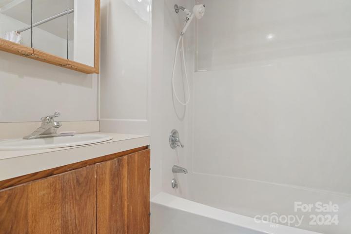 Primary bathroom with tub/shower combo on upper/main level