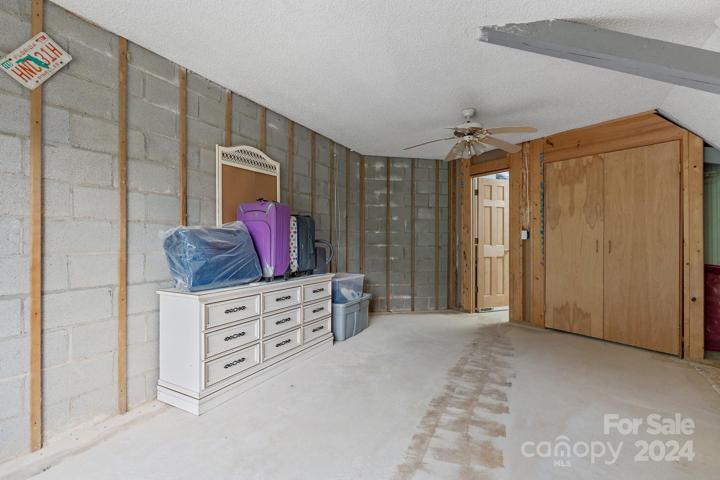 Unfinished room in lower level could be future bedroom or additional family room