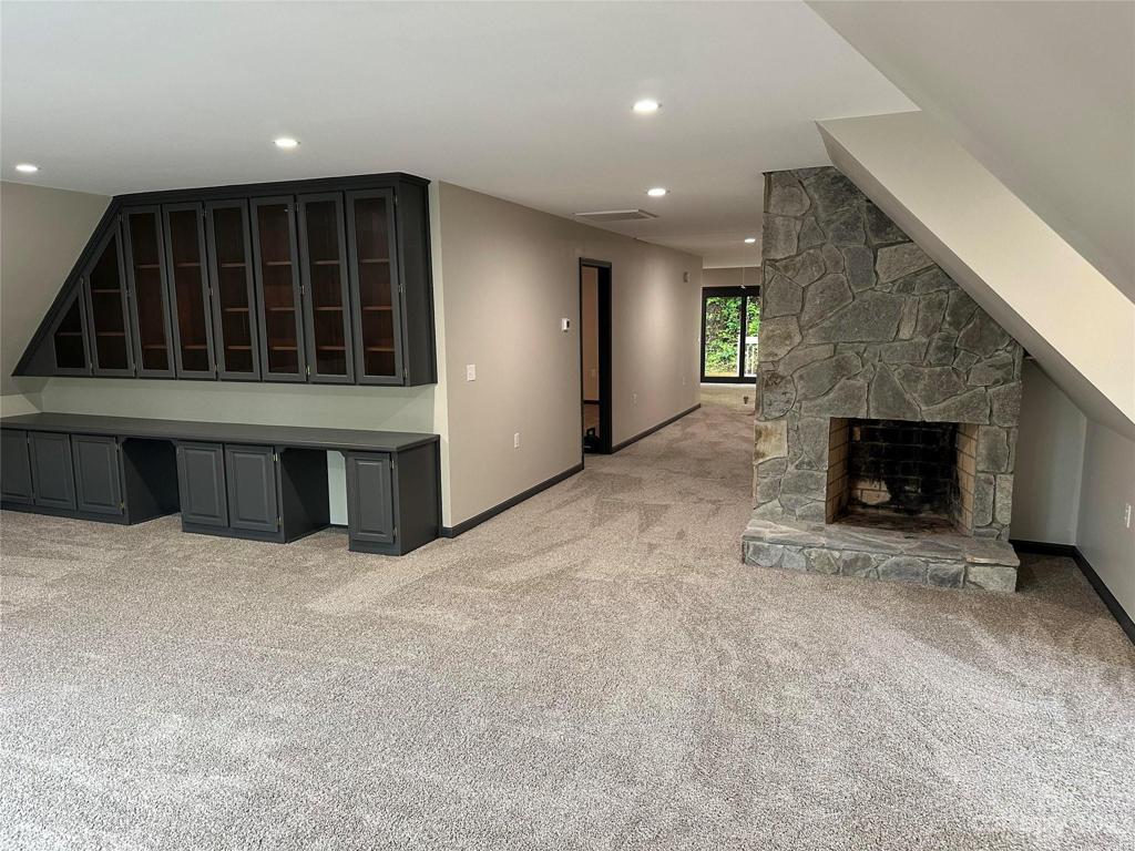 upper floor family room built in and fireplace