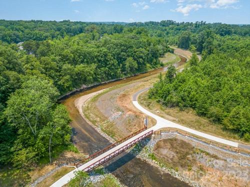 Carolina Tread trail entry from neighborhood. This entry is adjacent to the community pool, go over the bridge and park in the dirt parking lot.