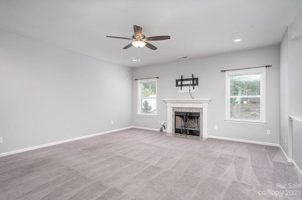 Great room with wood burning fireplace and wired for surround sound