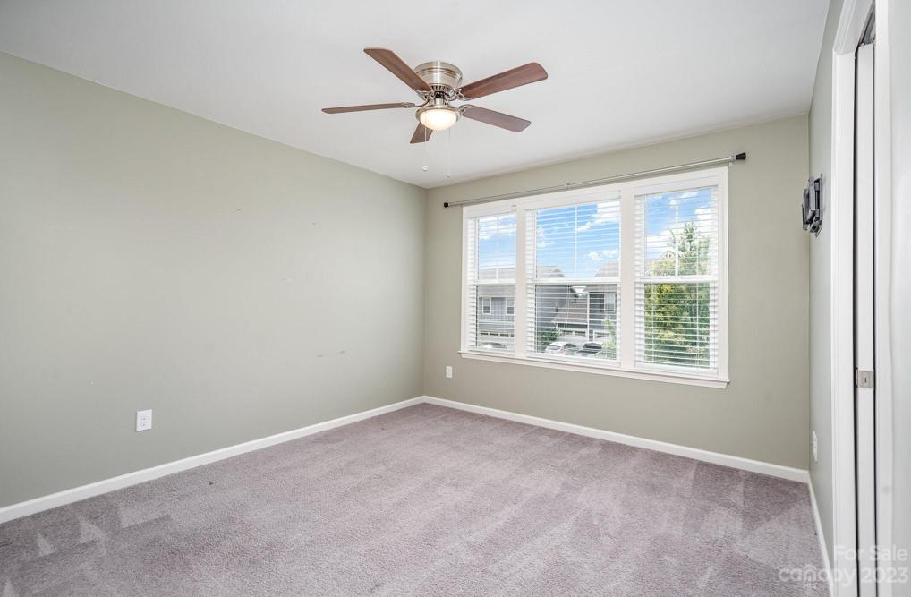 Bedroom #2 with tv mount and plenty of sunlight, Second level