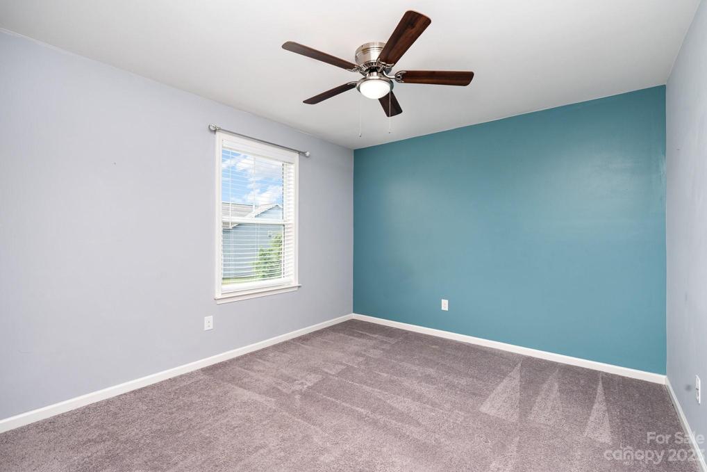 Bedroom #3 with walk-in closet that has a window inside, Second level