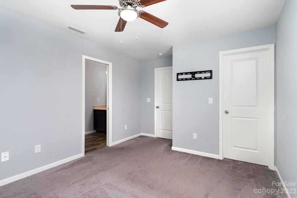 Bedroom #3 with walk-in closet that has a window inside, Second level