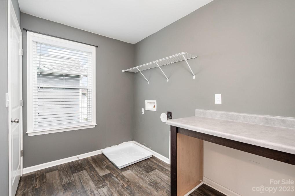 Laundry room with an added folding table and storage area.