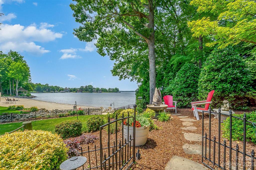 Lush Greenery, Long Range View, and a Sandy Beach are just a few of the things you will fall in love with in this Custom Built like new home in the gated community of Pointe Regatta!