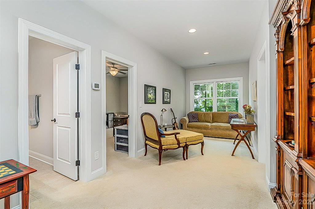 Loft area with a Bedroom on each side and a full Bath on the left.