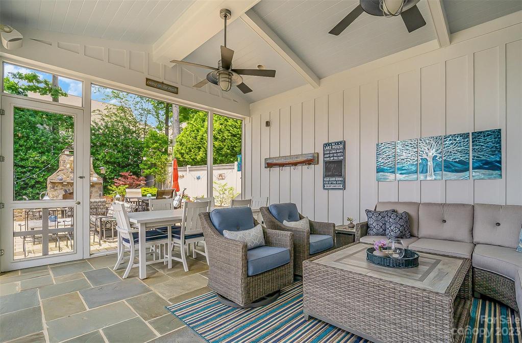 Plenty of room for the crowd to Relax on the Screened Porch designed for unobstructed view of the lake!
