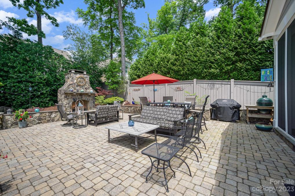 Large patio area to entertain a crowd and enjoy the evenings gathering around the wood burning fireplace.
