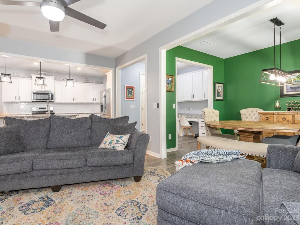 Living room open to dining and kitchen