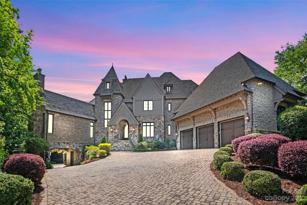 Perfectly positioned on a private cul-de-sac lot with golf & lake views of holes 12 & 13 of one of CLT's Finest golf courses, Ballantyne Country Club.