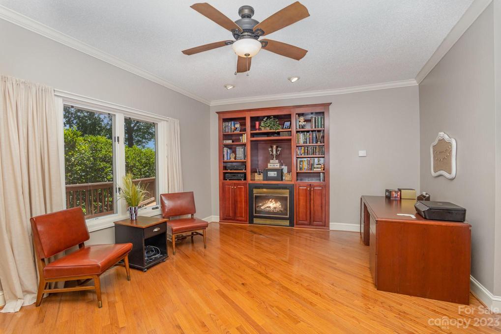 Sitting area with fireplace in primary suite
