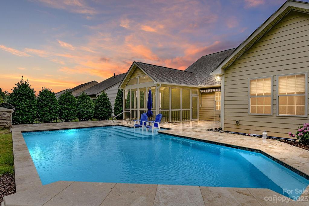 Twilight View of Pool and Home