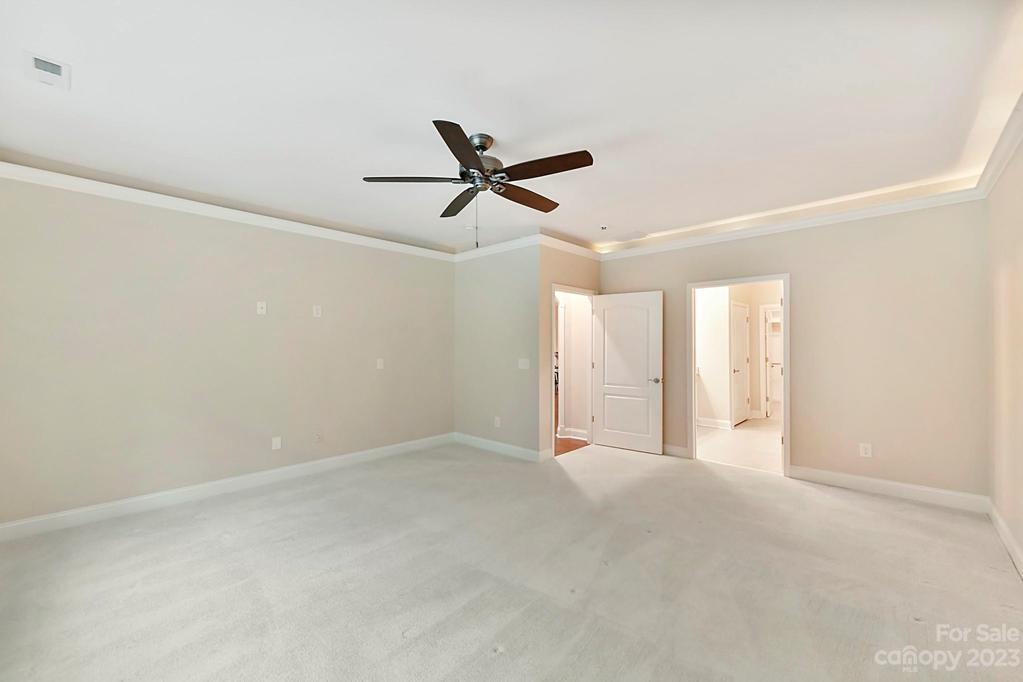 Primary Bedroom has Fan and Crown Moldings